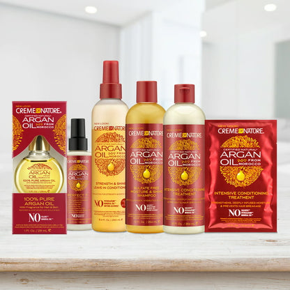 Immagine lifestyle della collezione Creme of Nature Argan Oil con alcuni prodotti esposti